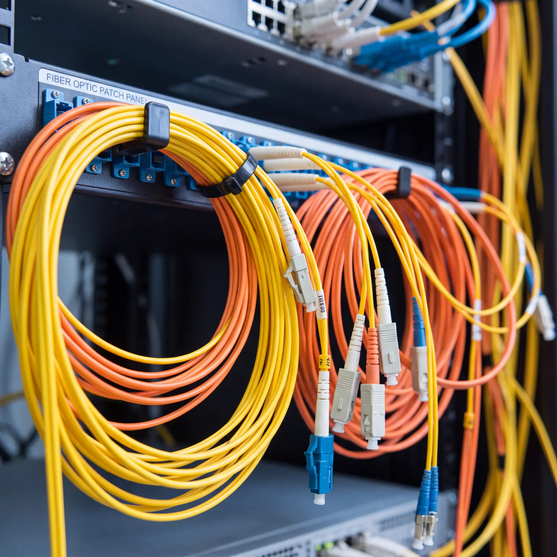 Fiber-optic jumpers connected to network equipment