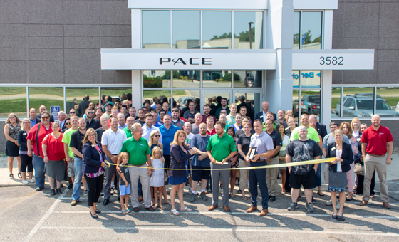 The Pace International team gathered outside the company's Minnesota headquarters.